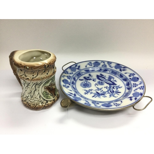 1334 - A WMF blue and white plate warmer and a Continental puzzle jug (2). Shipping category D.