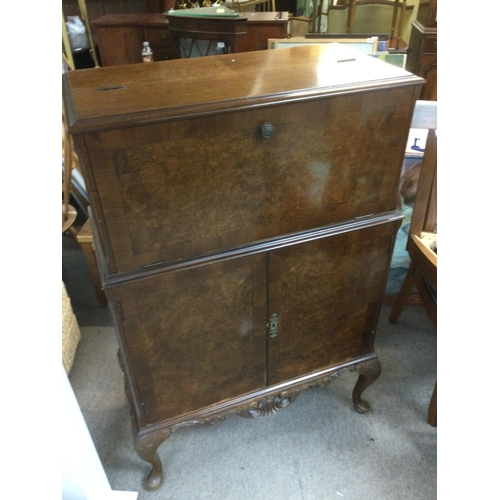 1515 - A walnut cocktail cabinet, approx 77cm x 40cm x 117cm. Shipping category D.