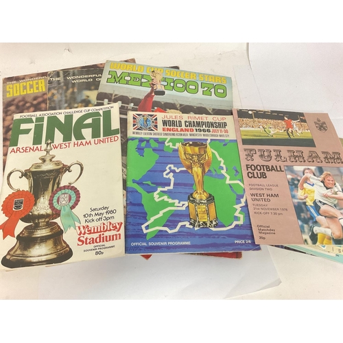 1766 - A collection of vintage football programmes and sticker albums including a 1966 World Cup Programme,... 