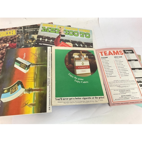 1766 - A collection of vintage football programmes and sticker albums including a 1966 World Cup Programme,... 