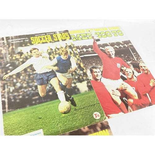 1766 - A collection of vintage football programmes and sticker albums including a 1966 World Cup Programme,... 