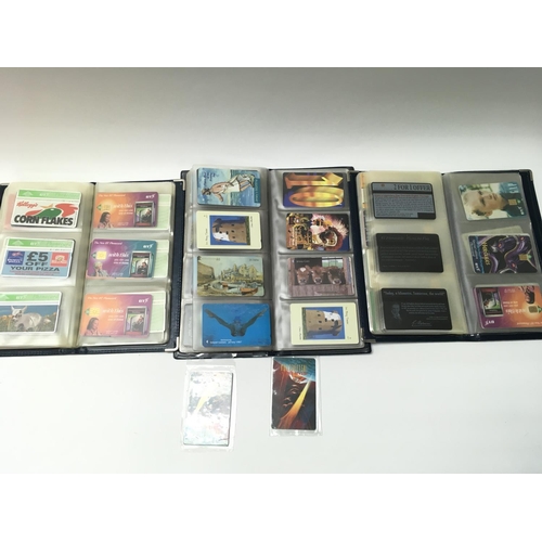 1805 - Three albums containing a large Coll of assorted phone cards. Postage B