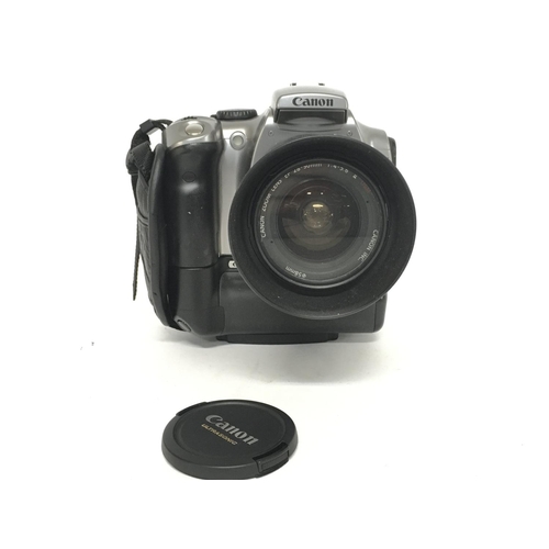 1930 - A Canon EOS 300D camera with a Canon 28-90mm EW-60C lens. Postage category C