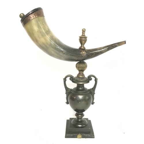 913 - A Horn snuff mull on a heavy bronze urn shaped base, approximately 42cm tall. Postage category D