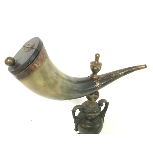 913 - A Horn snuff mull on a heavy bronze urn shaped base, approximately 42cm tall. Postage category D