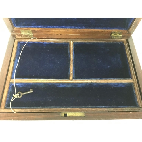 915 - A wooden box inlaid with brass, key, tray and interior mirror. Approximate dimensions 20x30x12.5cm. ... 