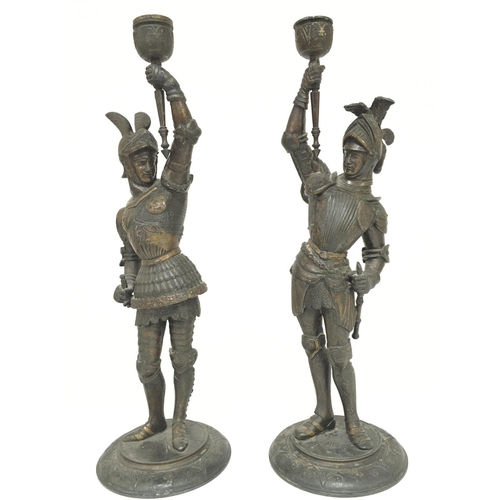 935 - A pair of Spelter knight candlesticks, 38cm postage category C