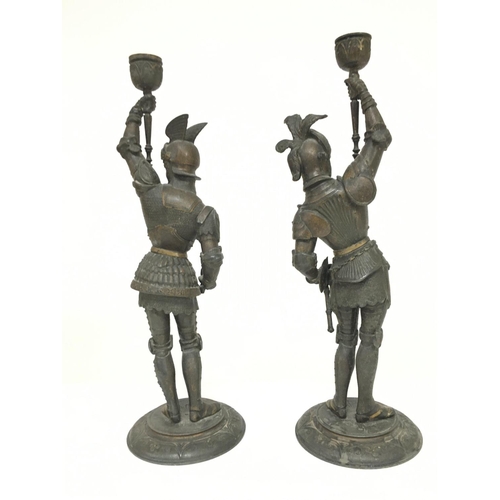 935 - A pair of Spelter knight candlesticks, 38cm postage category C