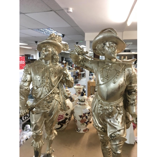 983 - A pair silvered spelter figures in the form of french cavaliers. 50c