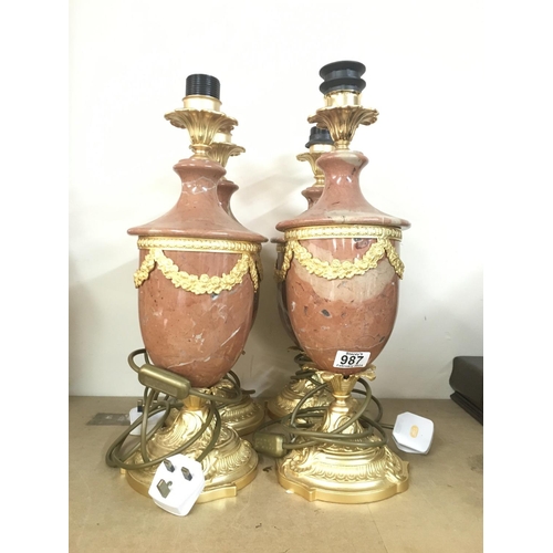 987 - Four guilt & marble lamps with classical influence. 47cm