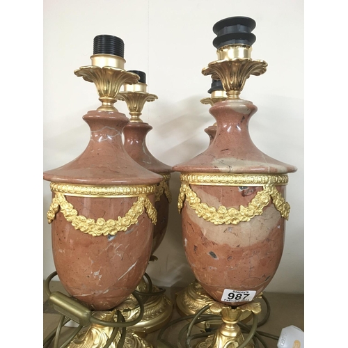 987 - Four guilt & marble lamps with classical influence. 47cm