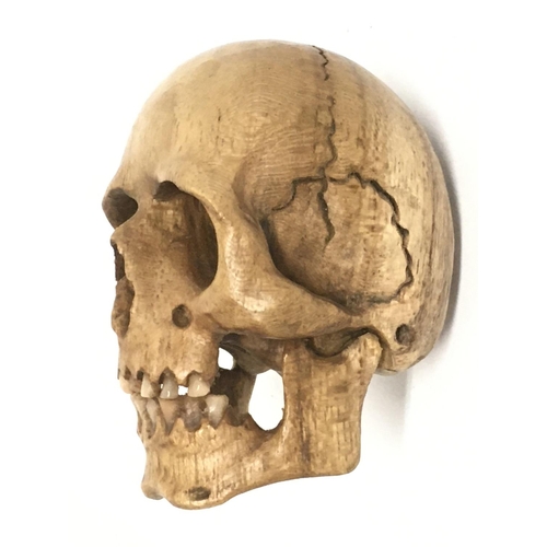 988 - A Memento Mori carved fruit wood skull. 7cm tall, 4.5cm in diameter. Postage category A