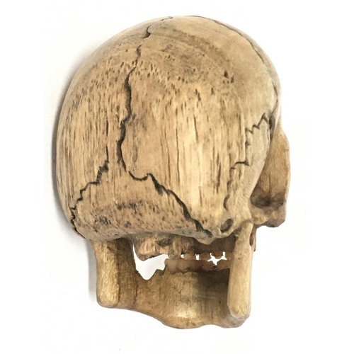 988 - A Memento Mori carved fruit wood skull. 7cm tall, 4.5cm in diameter. Postage category A