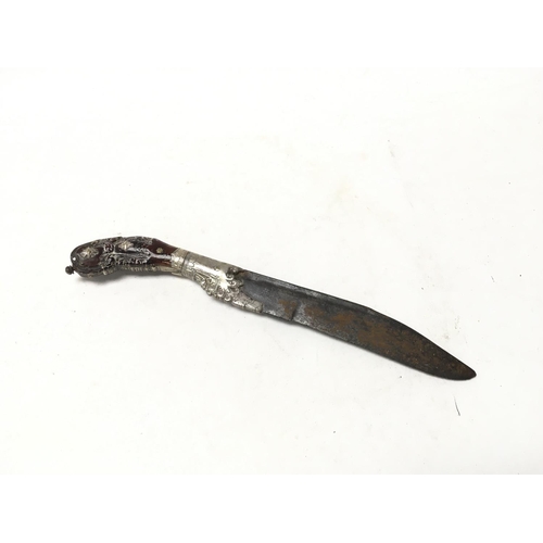 992 - A unusual white metal and carved wood dagger, possibly 18th century with a shape and decorative grip... 