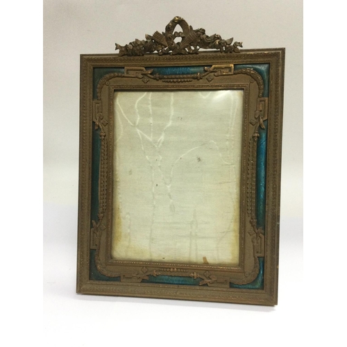 995 - A French brass and enamel photo frame, approx 24cm x 33cm. Shipping category D.