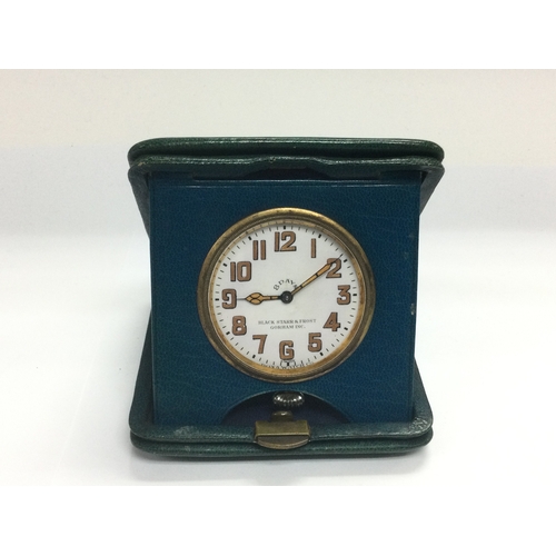 1000 - A vintage 8 day travelling clock. (B)