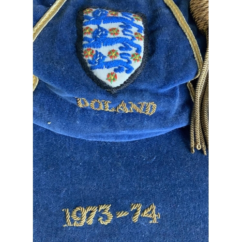 6 - John McDowell England Under 23 Football Cap: Blue tasseled cap with 3 Lions embroidered to front wit... 