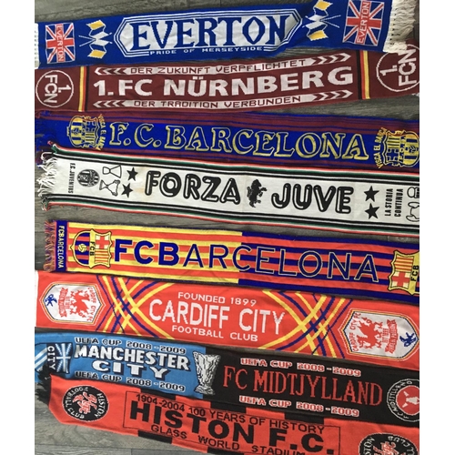 651 - Football Scarf + Flag Collection: Over 20 scarves which are often big European clubs with a couple o... 