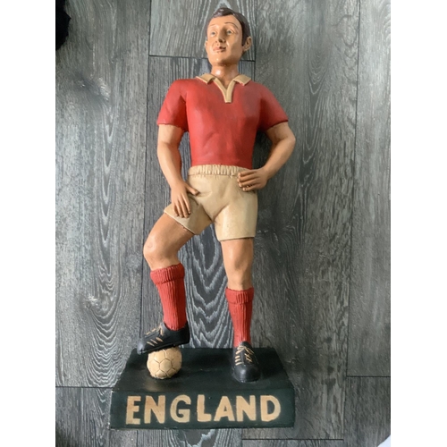 665 - Britains Toys Advertising England Football Figure: Footballer in red and white kit stood on black ba... 