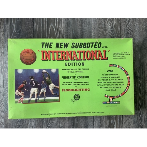 680 - Subbuteo International Boxed Football Game: Looks near complete inside with pitch floodlights teams ... 