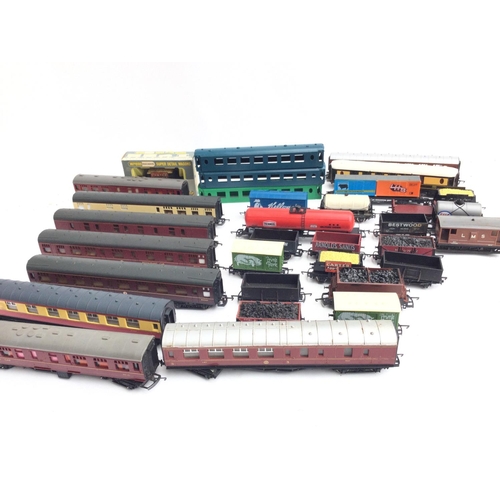 175 - A Box Containing A Collection of 00 Gauge Coaches and Rolling Stock.