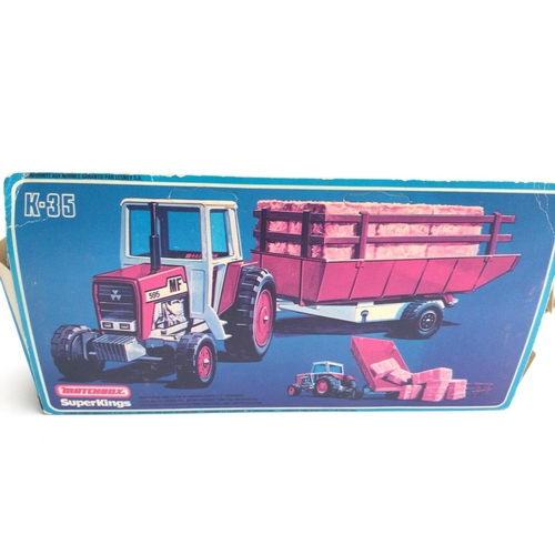 30 - A Boxed Machbox Massey Ferguson Tractor and Trailer. #K-35. Box Is Worn.