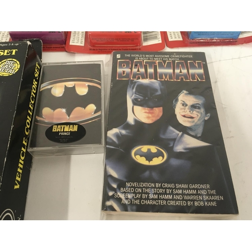 693 - A collection of Batman related items including diecast vehiclescollectors cards..surprise tins etc.... 