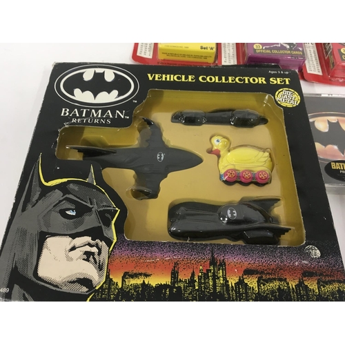 693 - A collection of Batman related items including diecast vehiclescollectors cards..surprise tins etc.... 