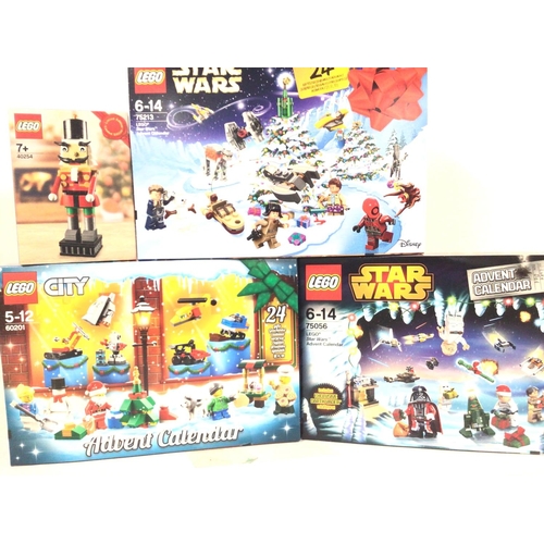 694 - 3 Boxed And Sealed Lego Advent Calendars. Lego City #6021. Star Wars #75056 and #75213. And a Nutcra... 