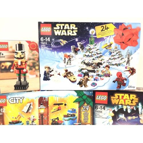 694 - 3 Boxed And Sealed Lego Advent Calendars. Lego City #6021. Star Wars #75056 and #75213. And a Nutcra... 