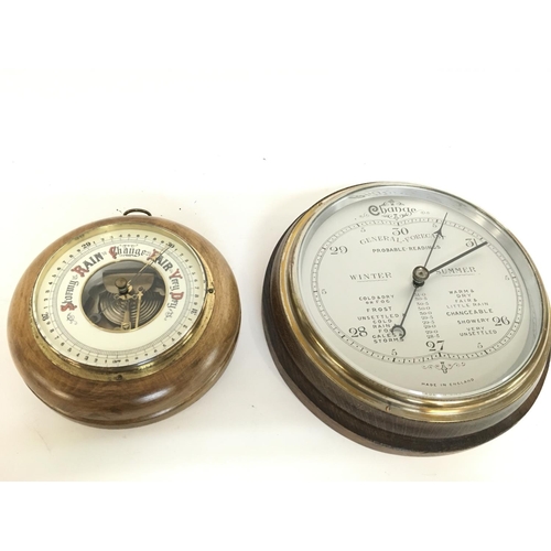 1313 - A silvered dial round wall barometer and an anroid barometer with visible mechanism, diameters of 26... 