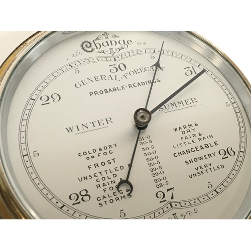 1313 - A silvered dial round wall barometer and an anroid barometer with visible mechanism, diameters of 26... 