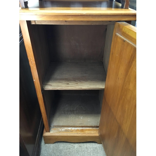 1325 - A satin walnut bedside cabinet. approx 77cmx41cm.