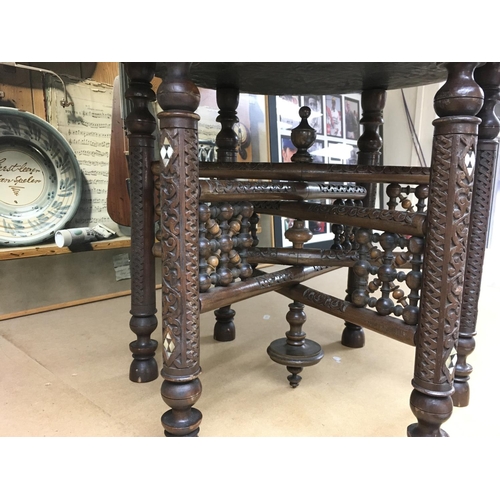 1347 - A Persian bobbin table. Approx 42cm high and 49cm wide.
