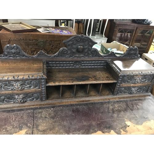 1353 - A Late Victorian oak carved desk with leather top, dimensions 75x152x126cm