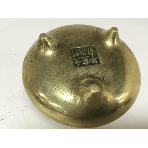 808 - A 19th century Chinese brass open censer with raised loop handles tripod base with impressed cast ca... 