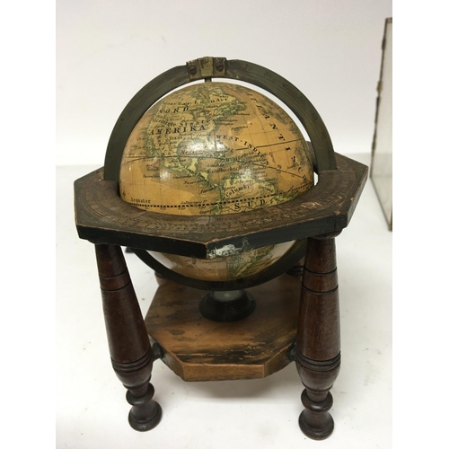 924 - A 19th Terrestrial Globe 4inch set in a measured brass loop and turned wood frame with outer edge pa... 