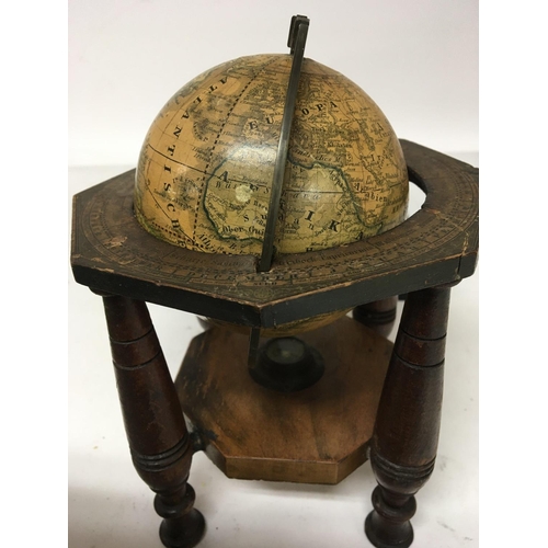 924 - A 19th Terrestrial Globe 4inch set in a measured brass loop and turned wood frame with outer edge pa... 