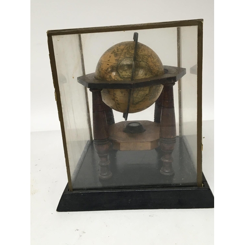 924 - A 19th Terrestrial Globe 4inch set in a measured brass loop and turned wood frame with outer edge pa... 