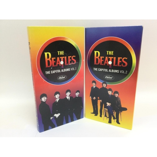 101 - Two Beatle CD long boxes comprising volumes 1 and 2 of 'The Capitol Albums'.