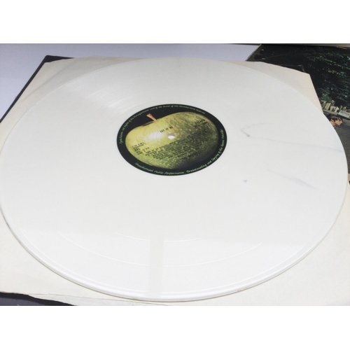 11 - A Beatles numbered 'White Album', an early UK pressing of 'Abbey Road' and a white vinyl 'Let It Be'... 