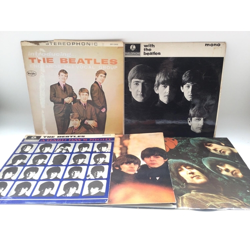 111 - Five Beatles LPs comprising four early UK pressings and a reissue of 'Introducing...' on the VeeJay ... 