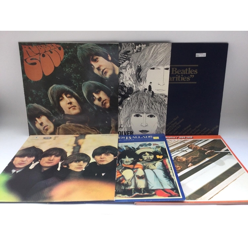137 - Six Beatles LPs, later reissues comprising 'Rubber Soul', 'Revolver' and others.