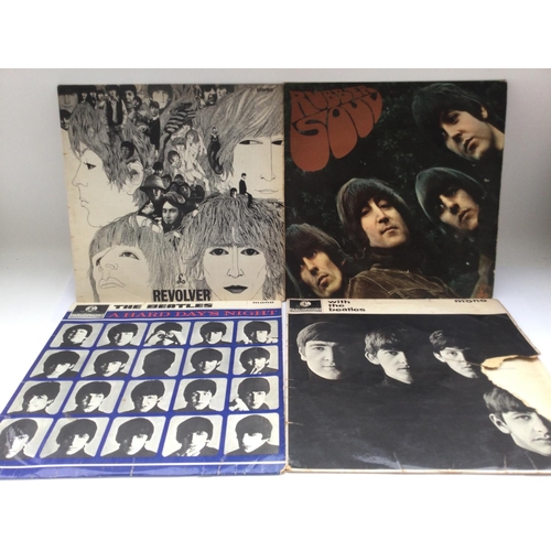 145 - Four early UK pressings of Beatles LPs comprising 'Revolver', 'Rubber Soul', 'With The Beatles' and ... 