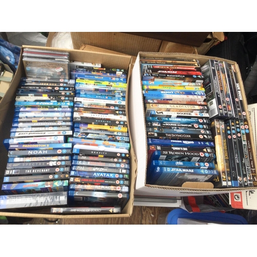 152 - Two boxes of BluRays and DVDs plus a sealed Laurel & Hardy DVD gift tin.