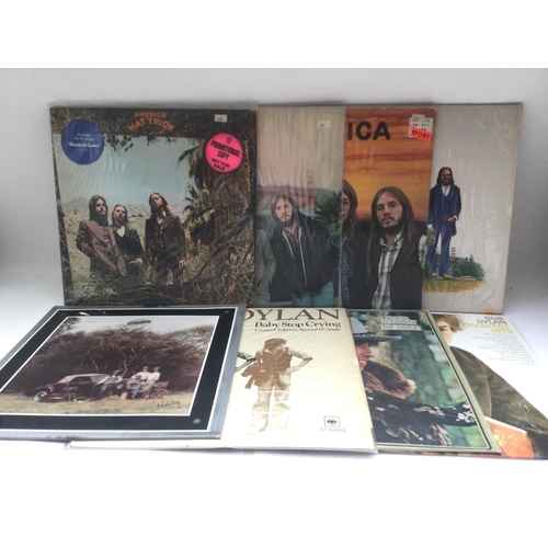 206 - Two bags containing seventeen folk rock LPs by various artists including Bob Dylan, Neil Young, Ry C... 