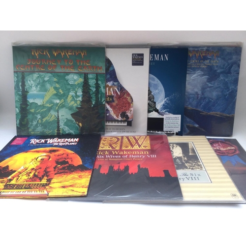 393 - Two bags containing 16 Rick Wakeman LPs comprising 180g vinyl and original pressings.