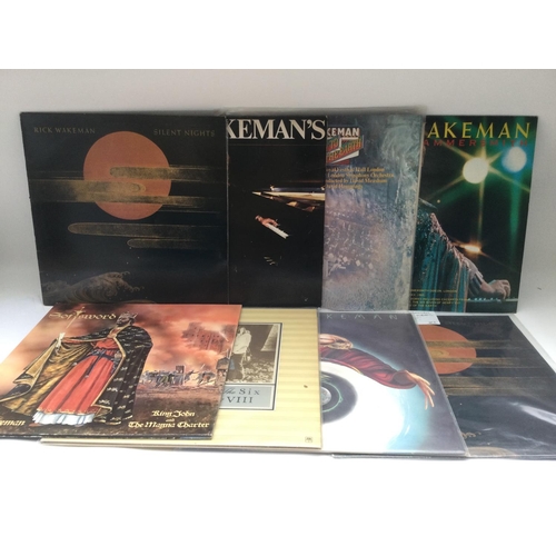 393 - Two bags containing 16 Rick Wakeman LPs comprising 180g vinyl and original pressings.