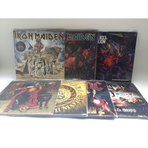 399 - Two bags containing seven rock LPs comprising 180g pressings of albums by Iron Maiden, Def Leppard, ... 