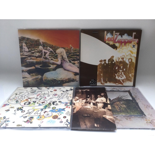 402 - Five Led Zeppelin LPs comprising 'Led Zeppelin II', 'Houses Of The Holy' and others. Sadly no red/pl... 